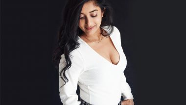 Meera Jasmine Shows Off Her Cleavage in White Top with Plunging Neckline (View Pic)